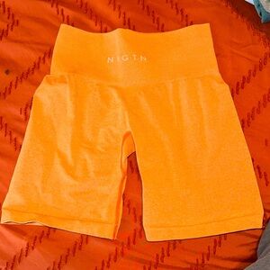 Orange NVGTN shorts. Like new!
